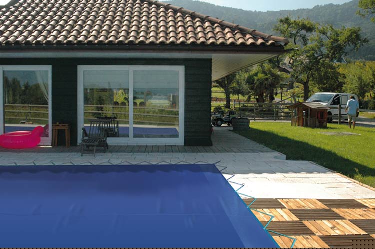 Ecold opaque winter cover in place on pool surface Ecold opaque winter cover in place on pool surface
